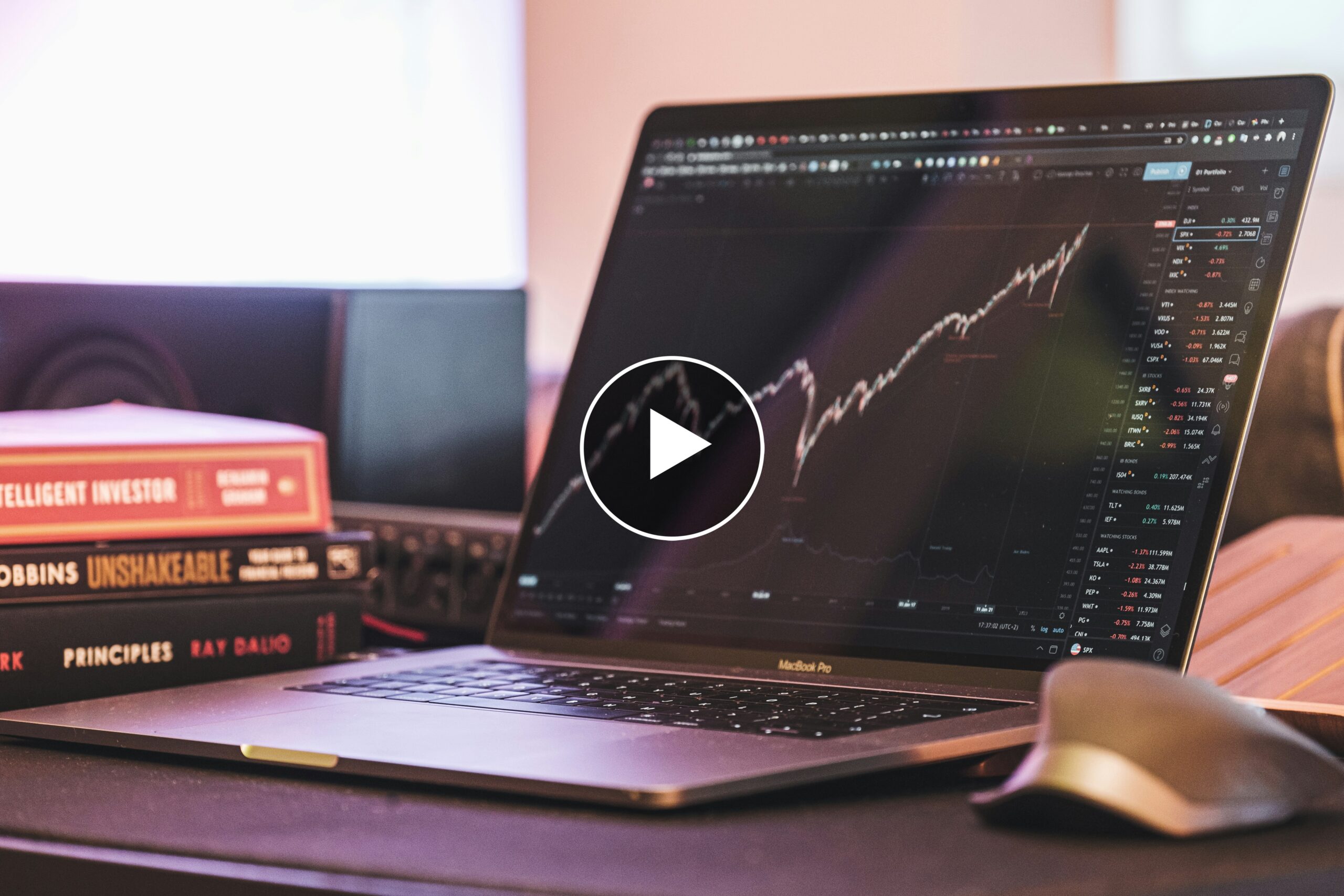 Financial Insights Laptop With Play Button